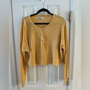 Large Hollister Buttery Yellow Ribbed Long Sleeve Top slightly cropped.